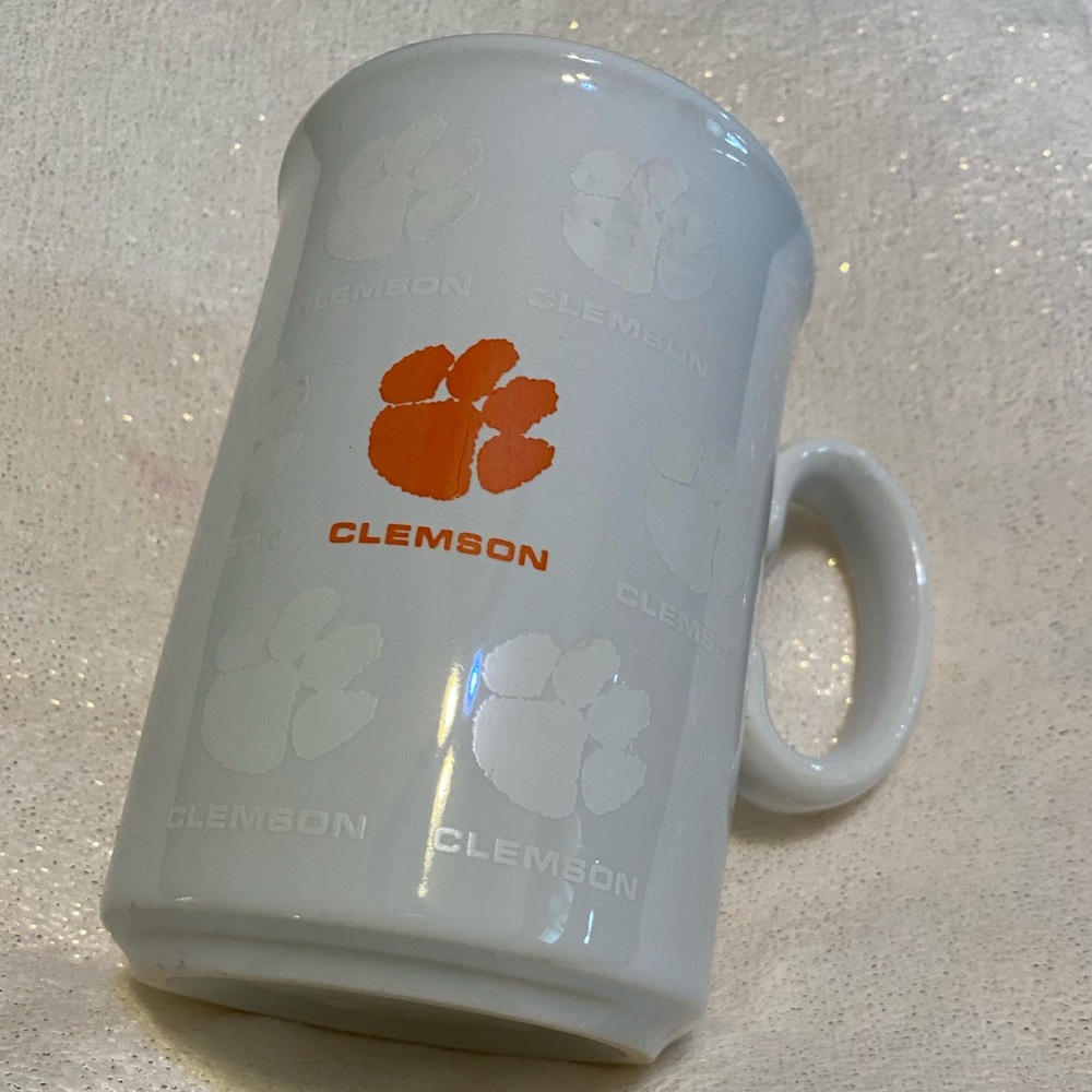 White Clemson mug with white iridescent paw print